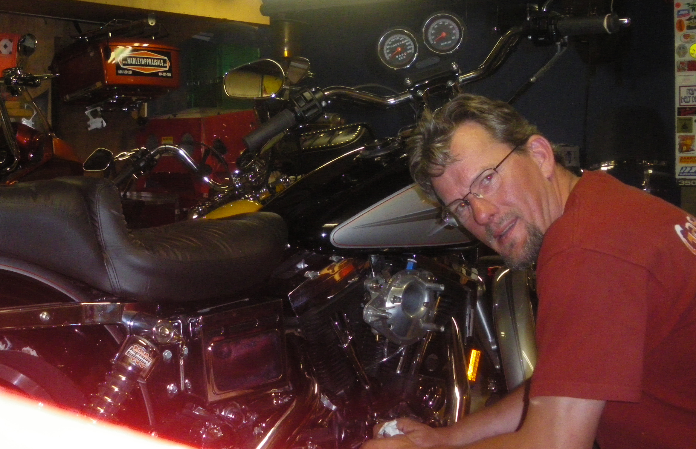 Ron Szoczei working on a Harley-Davidson in his shop